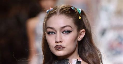 Gigi Hadid flashes nipples in completely sheer dress as she .